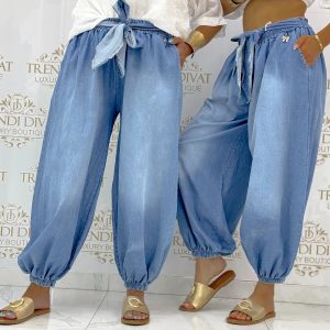Loose harem-style summer jeans with ties and gold-colored bow decoration
