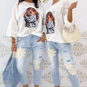 Laza fazonú, lenge vászon anyagú, gumírozott aljú, cicás női mintázatú felső